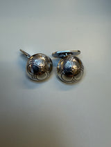 Mansjettknapper oksidert